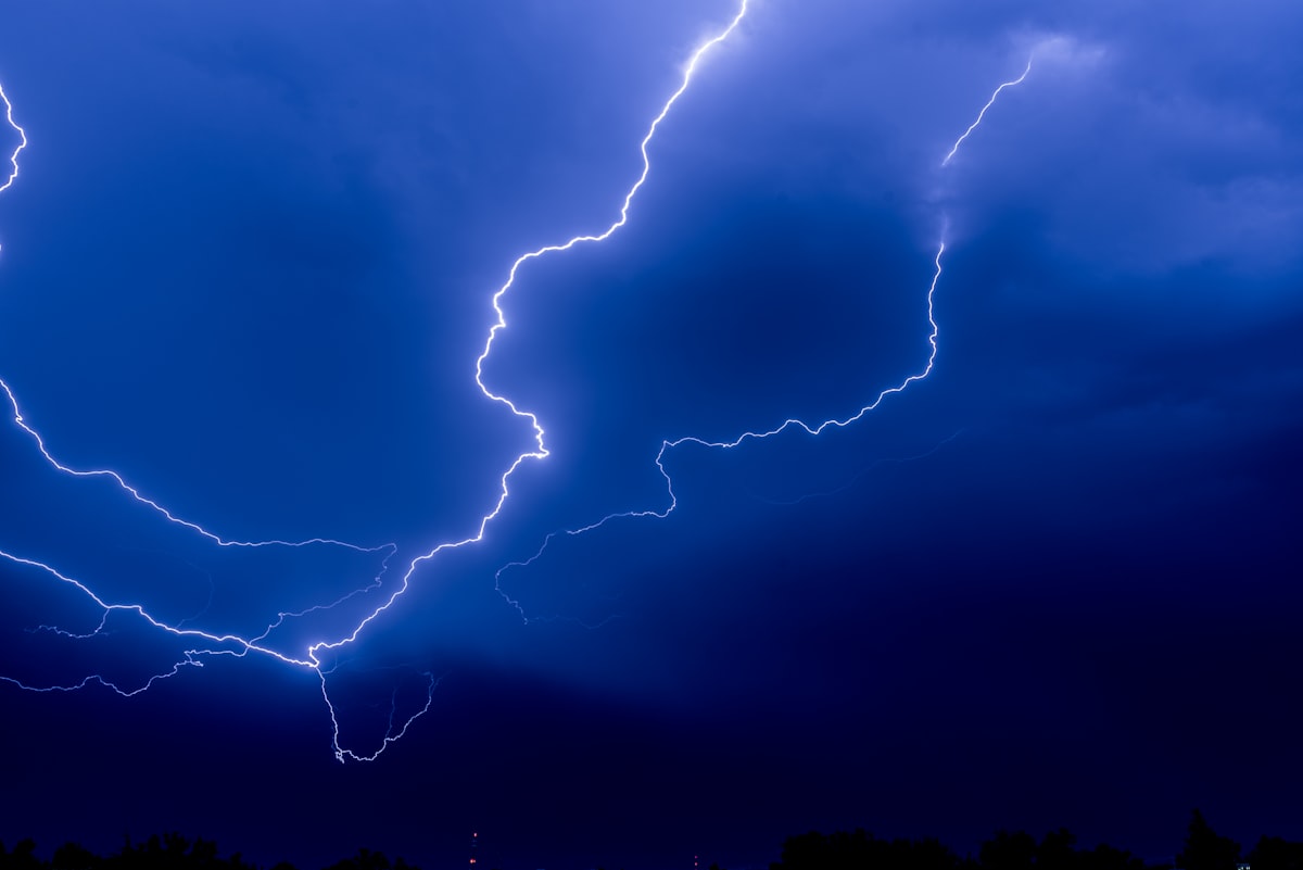 Lightning bolt striking during a dramatic night thunderstorm